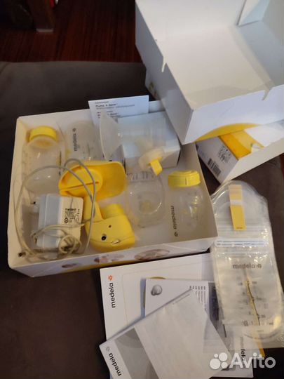 Молокоотсос medela электрический
