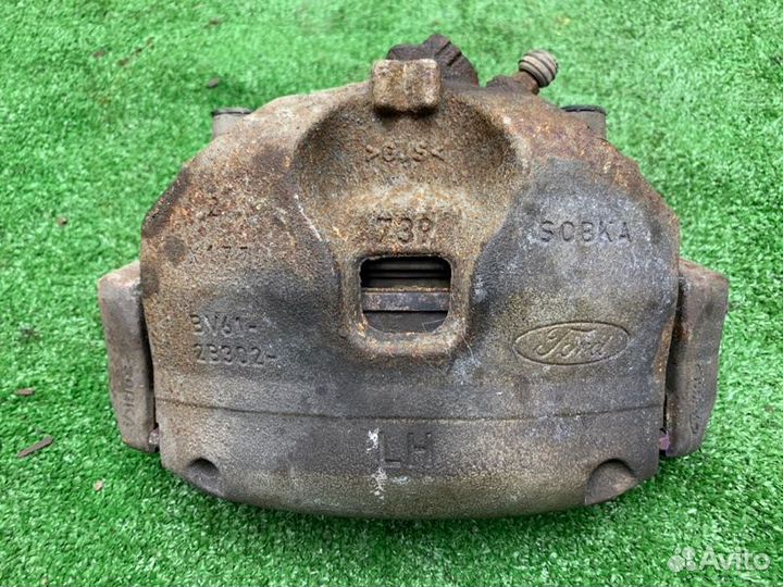 Суппорт тормозной левый Ford Kuga легковой