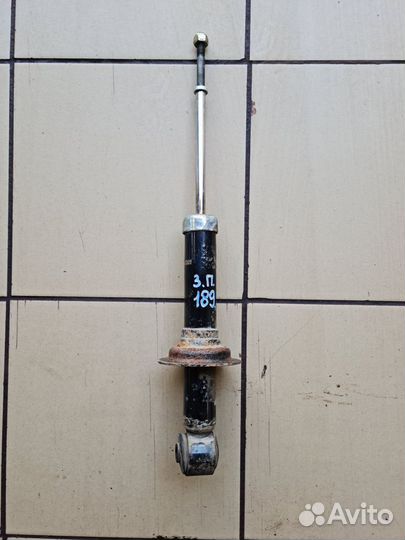 Стойка амортизатор задний Mitsubishi Lancer IX