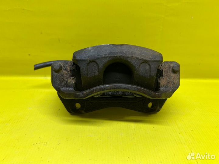 Суппорт тормозной передний левый Kia Forte седан