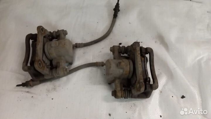 Суппорт задний левый Toyota Corolla E120