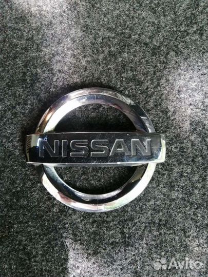 Эмблема Nissan