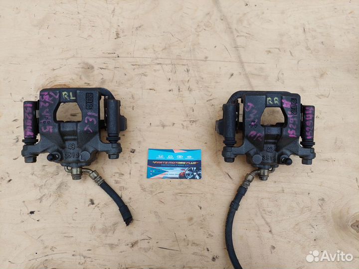 Суппорт тормозной задний левый Nissan Juke F15