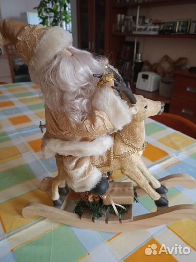 Дед мороз на олене музыкальная игрушка