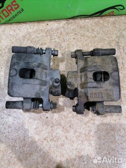 Суппорт тормозной задний левый Mitsubishi Lancer 9