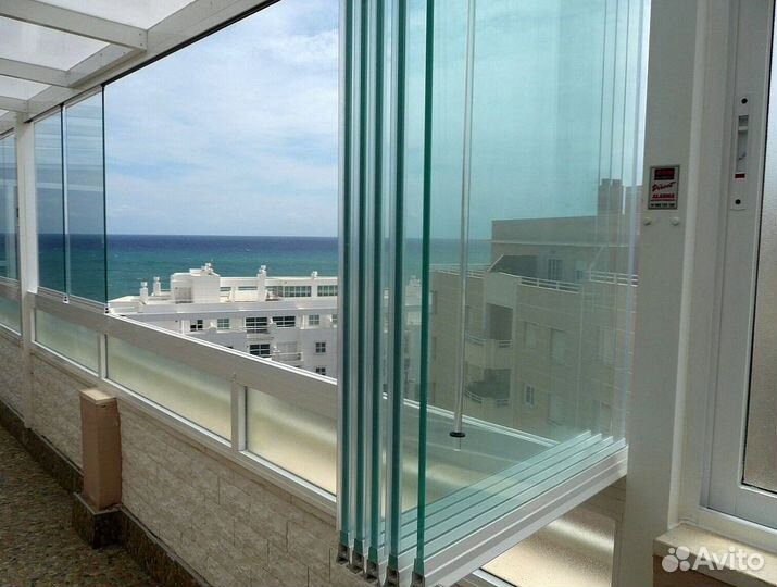 Безрамное раздвижное остекление