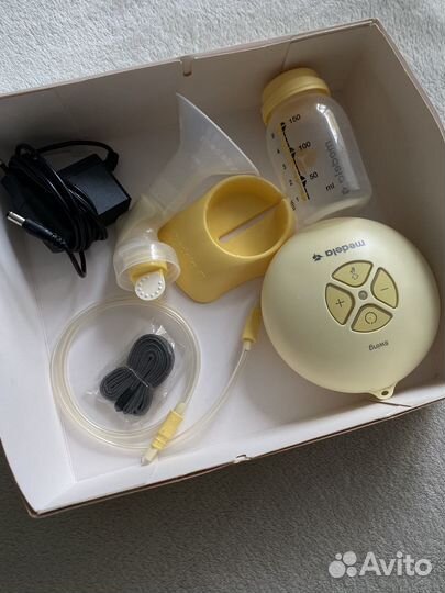 Молокоотсос medela электрический