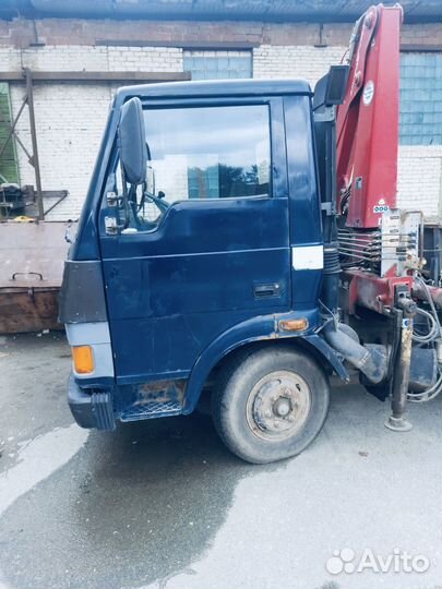 Бортовой грузовик TATA 613 с КМУ AMCO VEBA, 2010