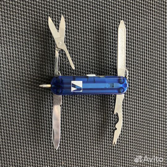 Карманный,нож от Victorinox С фонариком и ручкой