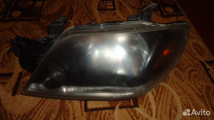 Фара левая Mitsubishi Outlander