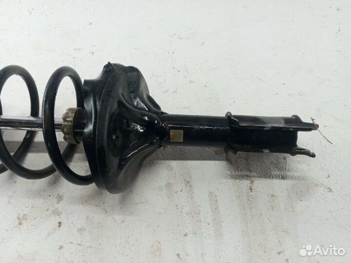 Амортизатор стойка передний левый Mitsubishi