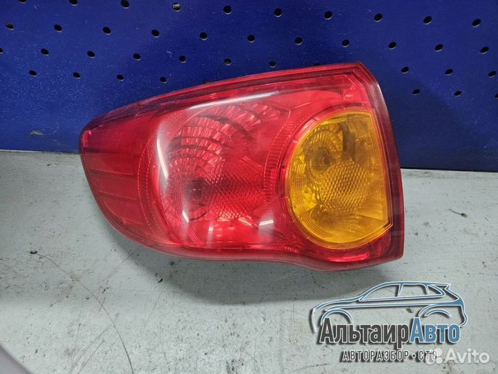 Фонарь задний левый Toyota Corolla E150 наружный
