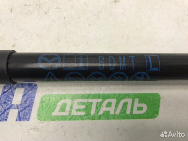 Амортизатор крышки багажника задний левый Mazda