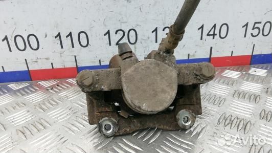 Суппорт тормозной задний левый toyota corolla vers