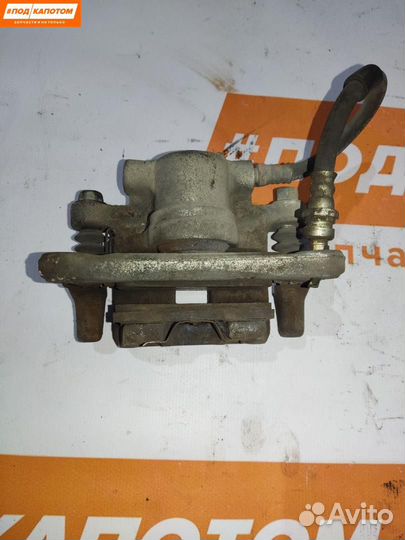 Суппорт тормозной задний левый Mitsubishi Lancer