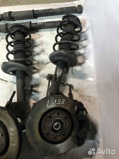 Стойка амортизатора передняя левая Peugeot 308