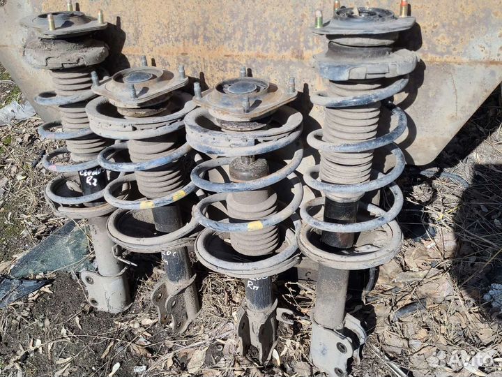 Стойки передние kia clarus