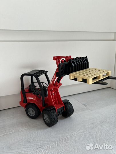 Игрушка bruder Мини - погрузчик schaeffer 2034