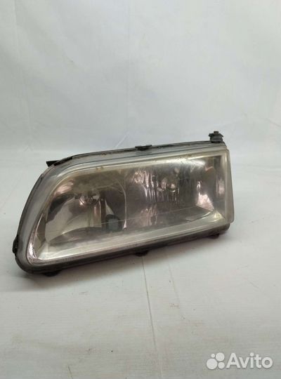 Фара передняя левая Mazda Capella
