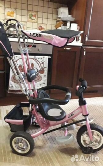 Трехколесный велосипед с ручкой