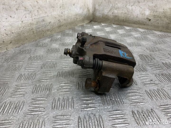 Суппорт тормозной задний левый Nissan X-Trail T30