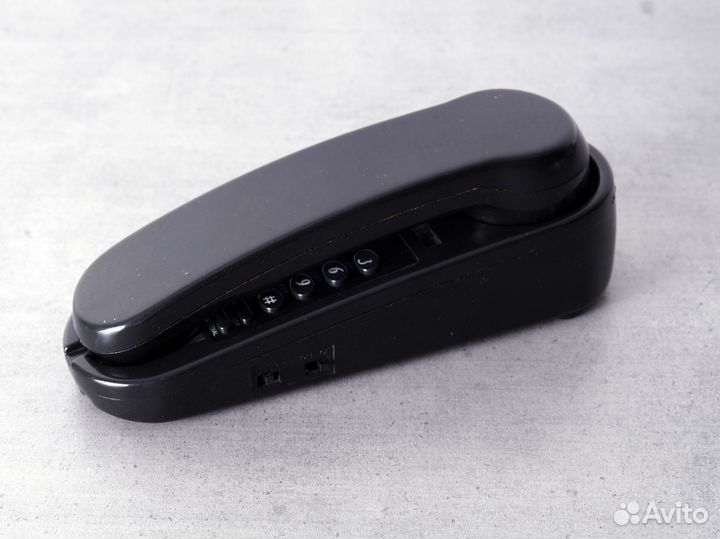 Стационарный телефон с кнопками на детали