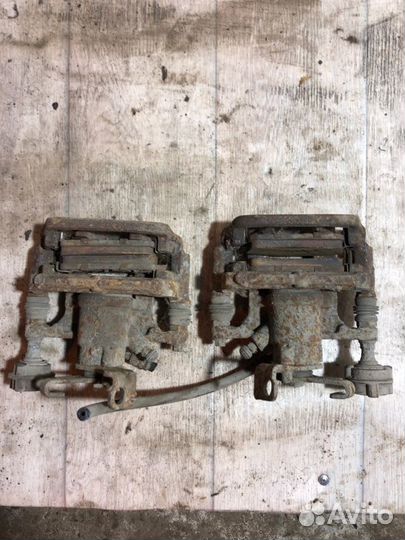 Суппорт тормозной задний левый Chevrolet Cruze 1.6