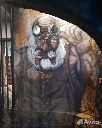 Рисунок на стене. Художник. Аэрография