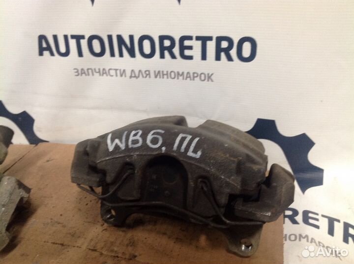 Суппорт тормозной передний левый Volkswage