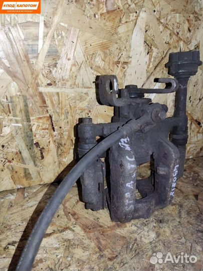 Суппорт тормозной задний левый Opel Astra J