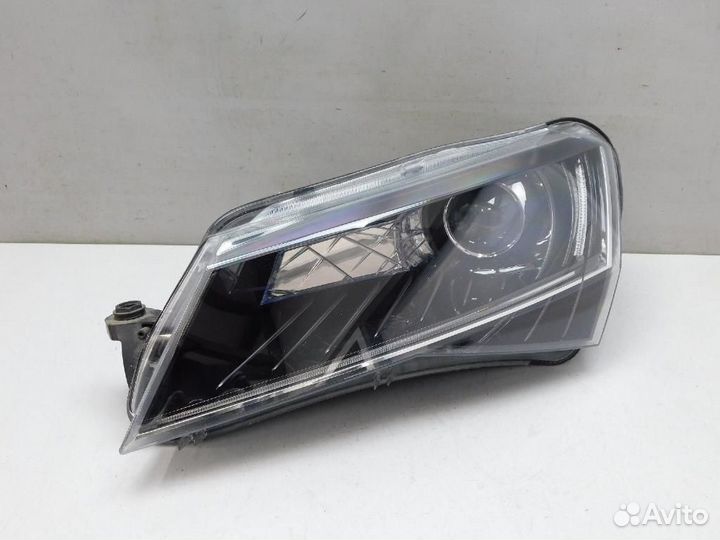 Фара левая Skoda Superb