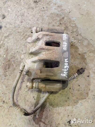 Суппорт тормозной передний Актион Нью Actyon New