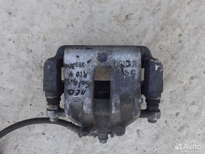 Тормозной супорт левый Hyundai Solaris 2 Rio 4