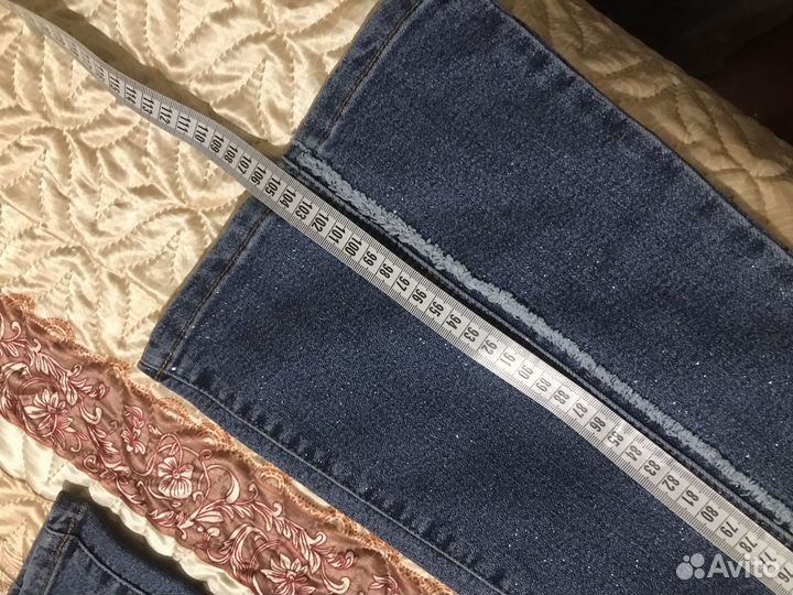 Джинсы клеш с бахромой