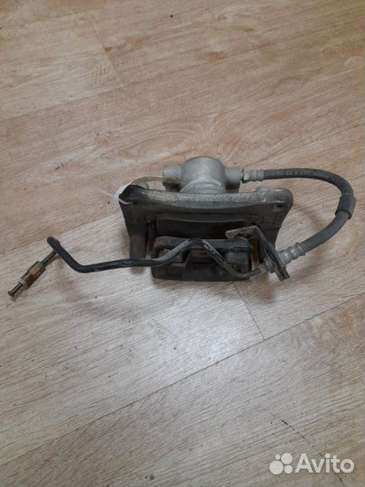 Суппорт тормозной задний левый Mitsubishi