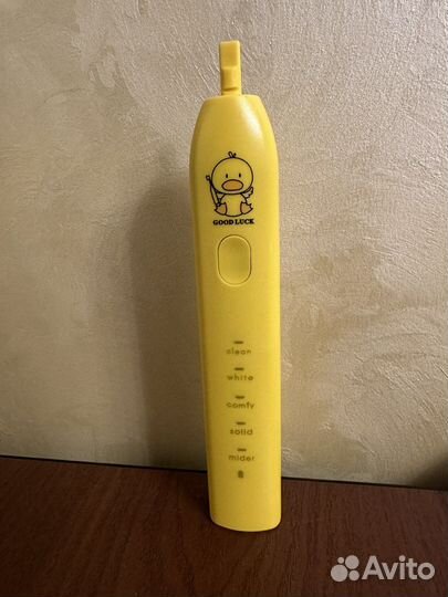 Электрическая зубная щетка