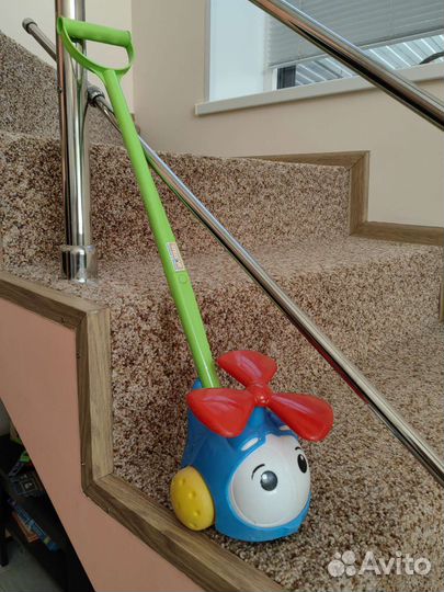 Игрушка каталка с ручкой вертолет