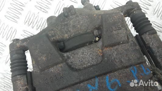 Суппорт тормозной передний левый opel astra J (TBN