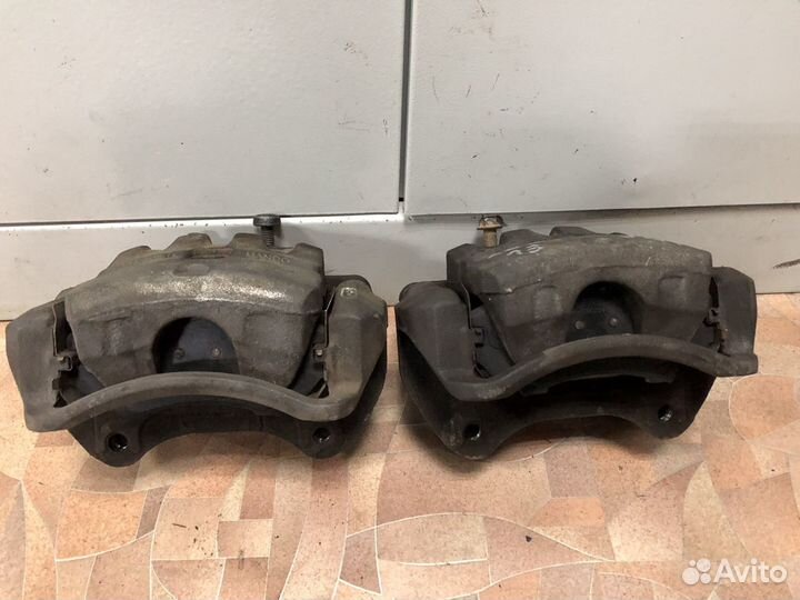 Суппорт передний Опель Астра j Gtc