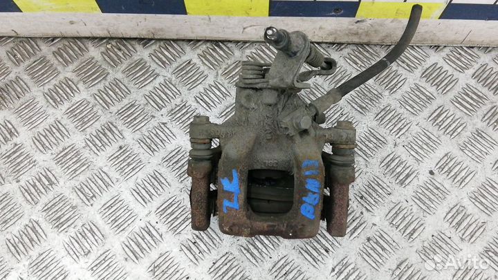 Суппорт тормозной задний левый на Skoda Octavia A5