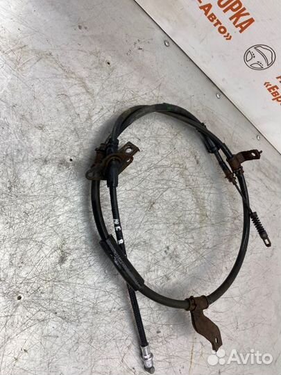 Трос стояночного тормоза левый Hyundai Sonata Nf