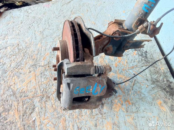 Суппорт тормозной передний Geely Emgrand EC7