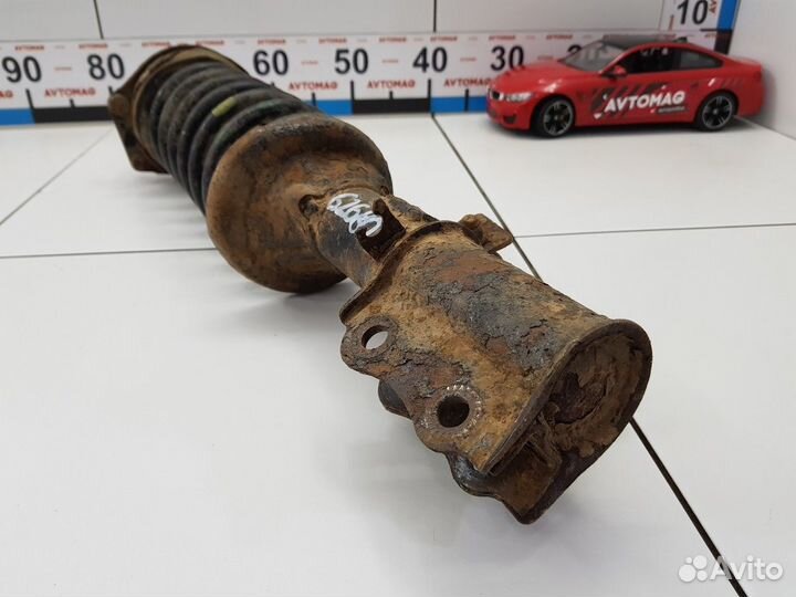 Амортизатор передний левый с пружиной (Kia Rio)