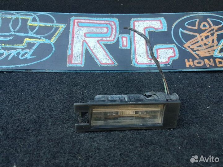 Фонарь подсветки номера Opel Astra H хэтчбек 1.6