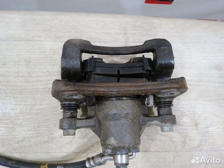 Суппорт тормозной задний правый KIA Sportage 3 SL