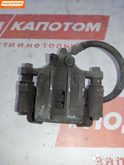 Суппорт тормозной задний левый Hyundai ix35 2009