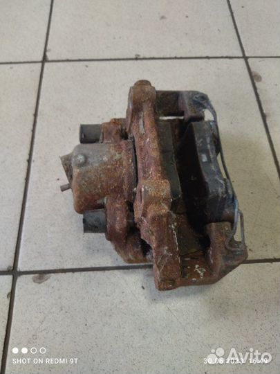 Суппорт тормозной передний правый Volkswagen Polo