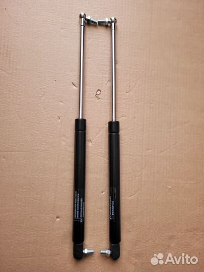 Газовые упоры багажника niva