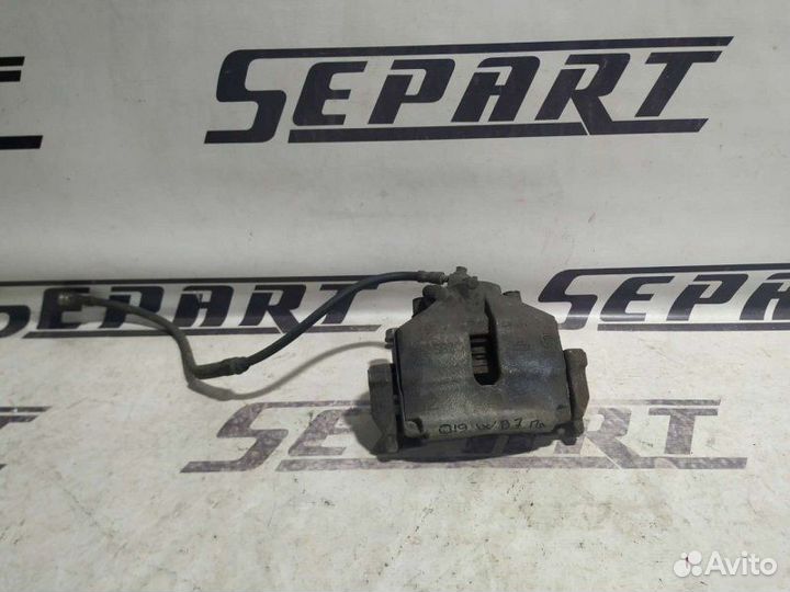 Суппорт передний правый Volkswagen Passat B7