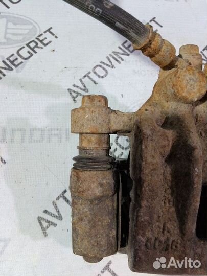 Суппорт тормозной задний Kia Cerato 1